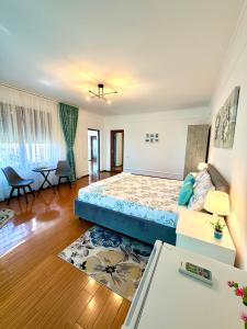 a living room with a bed and a couch at Casa Cristian Techirghiol in Techirghiol