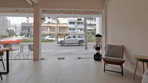 a robot standing in a room with a view of a street at Wonderful Bangkok in Bangkok