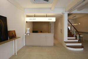 a hallway with a staircase in a building at Wonderful Bangkok in Bangkok