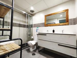 a bathroom with a sink and a toilet and a mirror at Chill and Beach in Torremolinos +15 photos