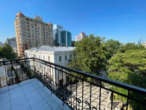 a balcony with a view of a white building at Azcot Nizami Hotel in Baku