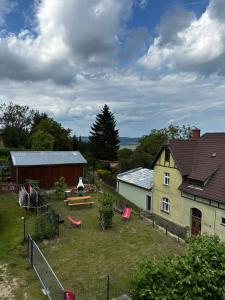an aerial view of a farm with a house at Apartament Eden in Srebrna Góra