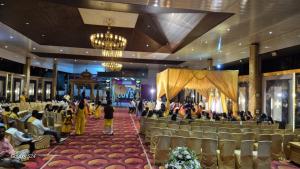a group of people sitting in a banquet hall at Star resort in Bhusāwal