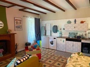 a room with a kitchen and a living room at Rêve du Revert in Roz-sur-Couesnon +11 photos