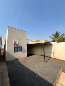 a house with a patio in front of it at CASA para TEMPORADA in Barra do Garças