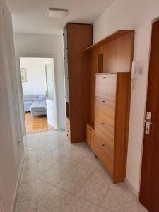 a room with a closet and a tiled floor at Apartment 7 in Izola