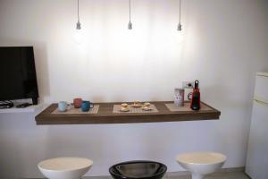 a shelf on a wall with food on it at Dai Massari in Villaggio Azzurro