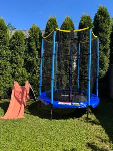 a playset in the grass with a slide at Sarajevo Flower Garden - Entire House & Private Garden in Vogošća