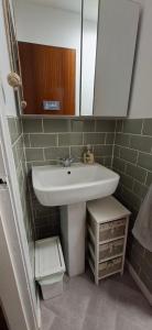 a bathroom with a sink and a mirror at Sailor's Rest in Anstruther