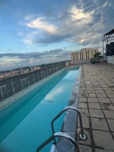 a swimming pool on the roof of a building at KHomes Luxury Bed & Breakfast in Nairobi
