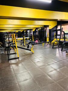 a gym with rows of tread machines in a room at KHomes Luxury Bed & Breakfast in Nairobi