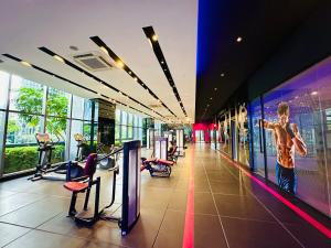 a gym with a picture of a man on the wall at GOLDEN Services Suites At Star KLCC in Kuala Lumpur