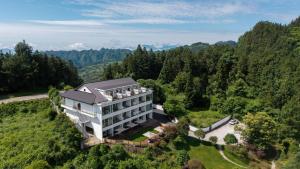 an aerial view of a building on a hill at Zhangjiajie National Park Nvue Resort Free Laundry & Dry Service,Free Fresh coffee& Customizing Tour Plan in Zhangjiajie