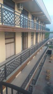 a balcony of a building with a view of the water at Hotel Datuna Aurum in Kobuleti +5 photos