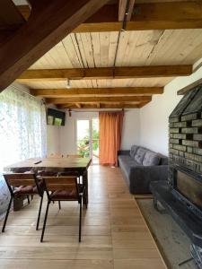 a living room with a table and a couch at Pustirnik in Rakhiv