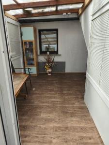 a hallway of a house with a table and a bench at Pri tetki 2 in Kranj
