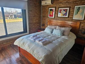 a large bed in a room with a window at Don Vito Casa de Huespedes in Cucullú +20 photos
