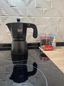 a black coffee maker sitting on a counter at Loft Jacuzzi Algarrobo in Arcos de la Frontera