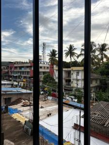a view of a construction site from a window at 1Rk Karwar downtown Studio in Kārwār