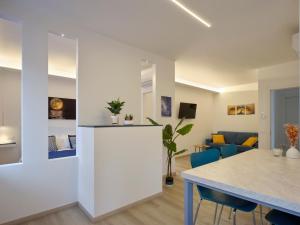 a kitchen and living room with a table and chairs at Palazzo house in Palazzo