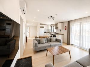 a living room with a couch and a table at NORA SUİTE in Trabzon