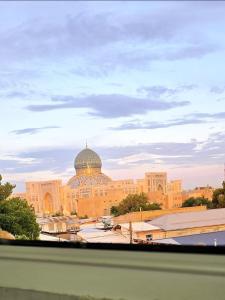 a large building with a dome on top of it at Cheap Hotel in Center in Tashkent
