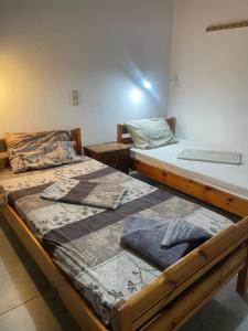 two beds sitting next to each other in a room at LYGIROS ANASTASIOS in Tarti