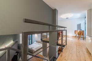 a room with a staircase with a bed in it at Effealatapartments - EdenLoft in Senigallia