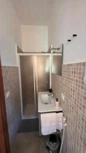 a bathroom with a sink and a shower at Mari del sud in Bagheria