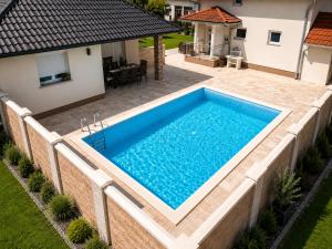 an overhead view of a swimming pool in a backyard at Villa Zlatan Poolside in Bosanska Gradiška