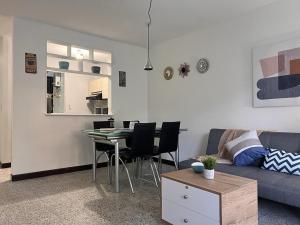 a living room with a couch and a table at Apartamento Flor de Manila in Medellín +35 photos