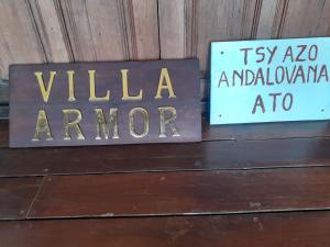 a sign that says villa amore and a sign that says viola armor at Villa Armor in Nosy Be