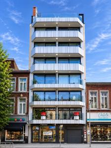 a tall building with a lot of windows at Chez EdGare in Liège