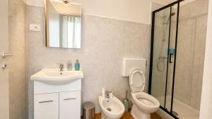 a bathroom with a toilet and a sink and a shower at A&D BnB in Porretta Terme