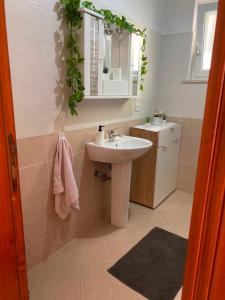 a bathroom with a sink and a mirror at Oleander House in Ponza +74 photos