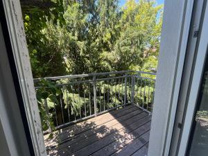 an open door to a porch with a fence at Süße Marie 19 - Coffee for free - in Karlsruhe
