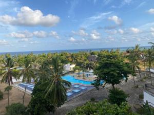 an aerial view of a resort with a swimming pool at Ocean view villa in Diani Beach