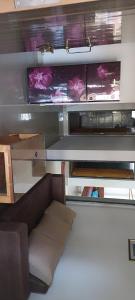 a living room with a couch and a table at Casa Branca in Siolim