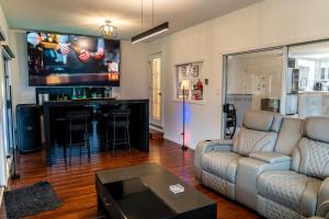a living room with a couch and a bar at Mountain Retreat Hope in Hope