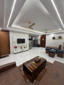 a living room with a couch and a table at The Green Hush in Rājpur