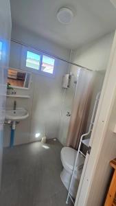 a bathroom with a toilet and a sink at Bamboo Khiri in Sathani Rot Fai