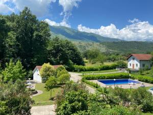 an aerial view of a house and a swimming pool at Zeta River Retreat in Danilovgrad