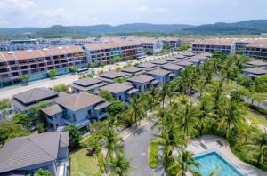 an aerial view of a resort with a pool and palm trees at MT Luxury Villas Phu Quoc in Phú Quốc
