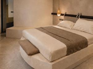 a bedroom with a large bed in a room at RHODEA Mar in Faliraki +5 photos