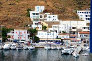 a group of boats are docked in a harbor at Litsas Studios Kythnos in Kithnos