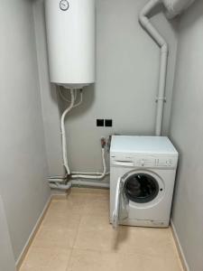 a washer and dryer in a laundry room at PETROKALIVa in Galatás