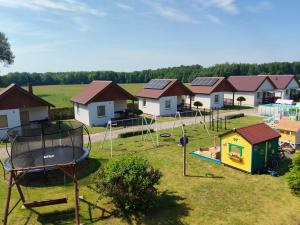an aerial view of a playground with houses at Domki Pod Kasztanem in Dąbki