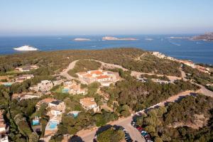 an aerial view of a resort with a cruise ship at GG Luxury Apartments - Porto Cervo - Costa Smeralda in Porto Cervo