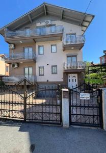 a building with a gate in front of it at DrimResidence in Struga