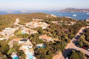 an aerial view of a large mansion with the ocean at GG Luxury Apartments - Porto Cervo - Costa Smeralda in Porto Cervo